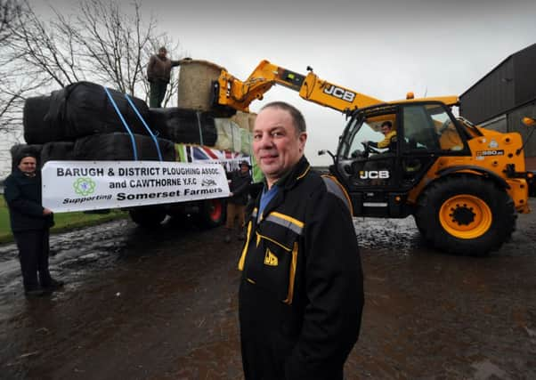 Donated fodder supplies for farmers caught up in the floods are loaded up at Mount Farm, Wakefield by Philip Rowbottom.