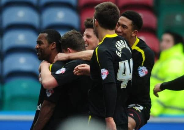 Wednesday's Jacques Maghoma celebrates his goal.