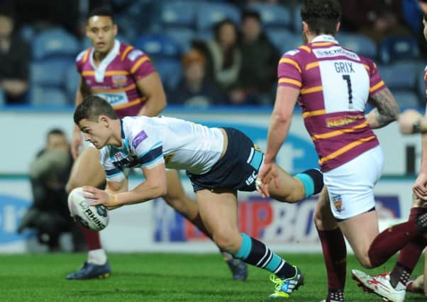 LEVEL PEGGING: Stevie Ward goes over Leeds against Huddersfield last night.