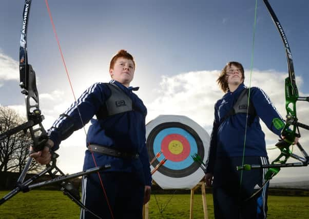 Jessie and Lewis Slater, champion archers at the Nova Bowmen, Scholes.  Picture: Bruce Rollinson