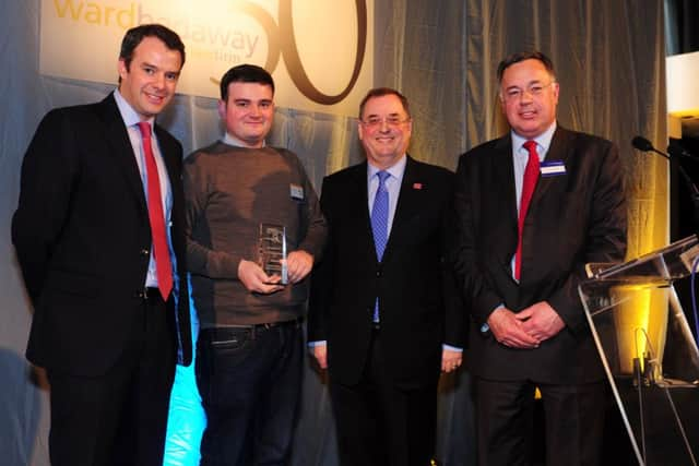 Rob Matheson, second left, of Auto Silicone Hoses Ltd with his Yorkshire Fastest 50 Award presented by Bernard Ginns, Roger Marsh and Jamie Martin