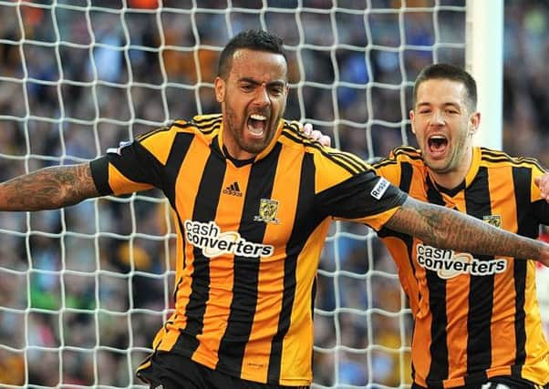 Hull City's Tom Huddlestone, left.