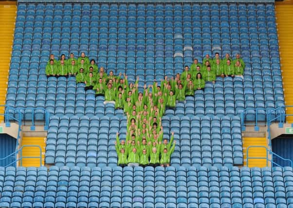 Tour Makers form a 'Y' in the East Stand after the first session of role training and uniform collection at Elland Road stadium, in Leeds. Picture Bruce Rollinson