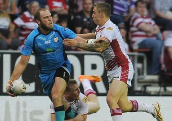 Richard Whiting of Hull passes inside against Wigan. (Picture: Steve Riding).