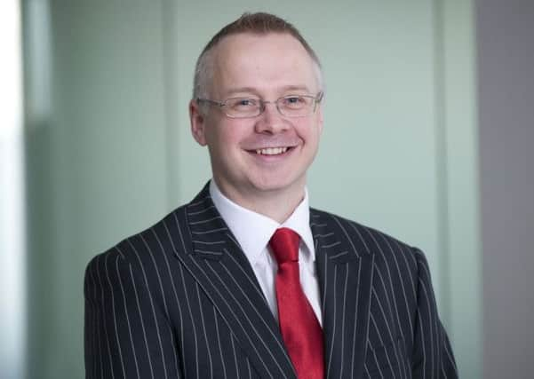 Alistair Denton, a partner at EY