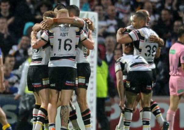 Bradford Bulls' players celebrate after beating Leeds Rhinos.