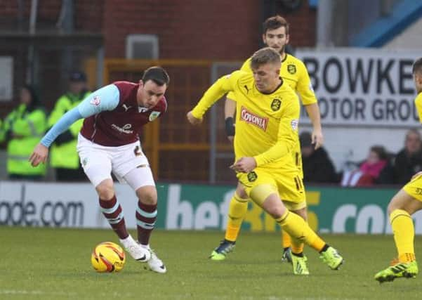 ON THE BALL: Barnsley signing Keith Treacy attacks the Huddersfield defence for Burnley last season. Picture: Andrew Smith