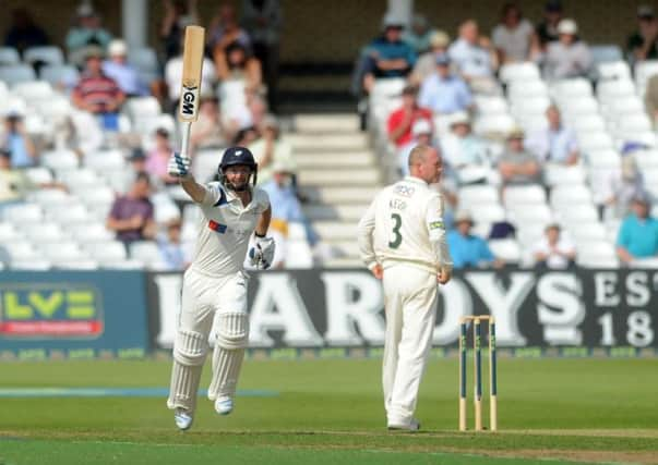 Yorkshires Adam Lyth celebrates his century against Nottinghamshire at Trent Bridge yesterday. He went on to make 122 (Picture: Jonathan Gawthorpe).