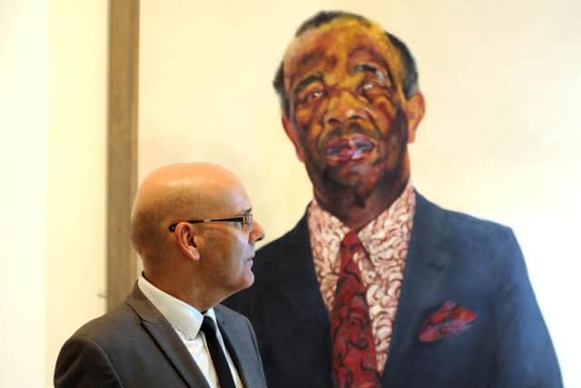 Nino Vella is pictured with the portrait of Charlie Abrew by Maggi Hambling , at the Hepworth Gallery, Wakefield....1001890b..18th September 2014 ..Picture by Simon Hulme