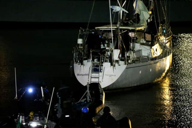 The yacht Makayabella is led into Haulbowline naval base, Cobh, Co Cork after the Irish Navy intercepted the vessel suspected of carrying around 80 million euro worth of cocaine