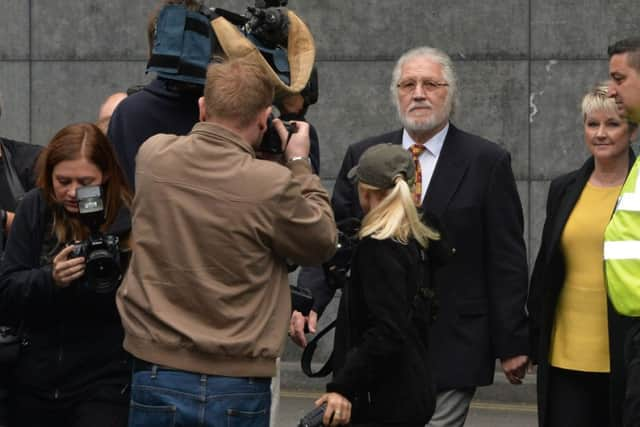 Former Radio 1 DJ Dave Lee Travis arrives at Southwark Crown Court with his wife Marianne