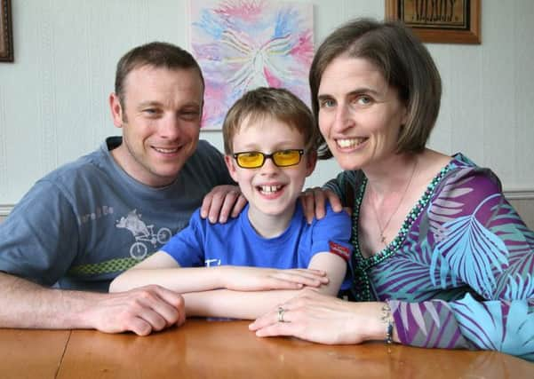 Adam Fernyhoughwith his parents Helen and Phil