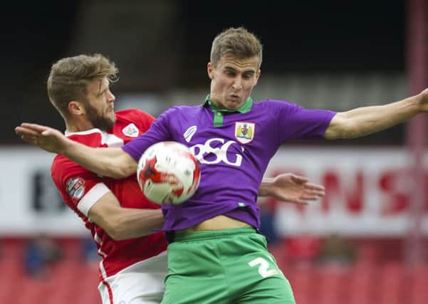 Barnsleys Martin Cranie and Joe Bryan, of Bristol City, battle during Saturdays 2-2 draw  at Oakwell. Picture: Dean Atkins.