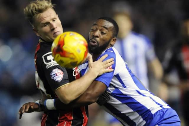 Sheffield Wednesdays Jacques Maghoma duels with Bournemouths Matt Ritchie (Picture: Steve Ellis).