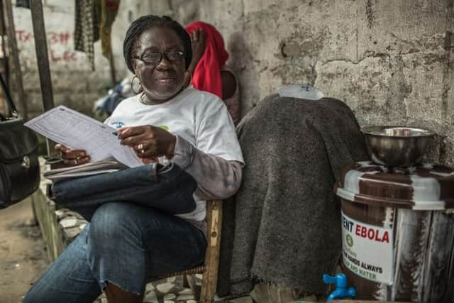 Agnes Nyantie. 42 age, 5 children. Community Health Volunteer.

	 

	Agnes Nyantie&rsquo;s unassuming manner hides a spirit that will be key in overcoming Liberia&rsquo;s Ebola crisis. The 42 year old mother of five goes on her daily door to door round of houses in the insanitary back alleys of West Point to offer people advice on the deadly virus.
	
	Yards away from West Point&rsquo;s narrow through road, with its bustling street-side markets and shops offering  everything from dark brown smoked fish to dubious looking dentistry, Agnes talks calmly to families about how best to prevent catching Ebola and what to do if they suspect someone has it.
	
	The spectre of Ebola tore through West Point some weeks ago, so much so that the government closed the place down and quarantined 80,000 people inside. The quarantine was supposed to be for 21 days and was met with an angry reaction. West Point is one of Monrovia poorest slums and with nothing coming in or going out people were running out of food and prices were