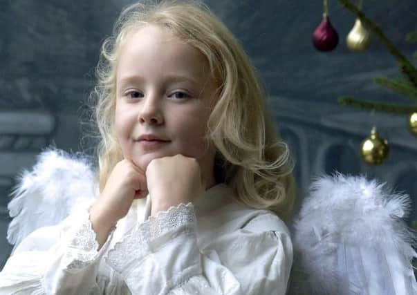 Sophie Cheal (6) in typical  Christmas dress in the the Edwardian Hayes studio, believed to be the oldest daylight photographic studio in the country at Ryedale Folk Museum. Pictures: Tony Bartholomew