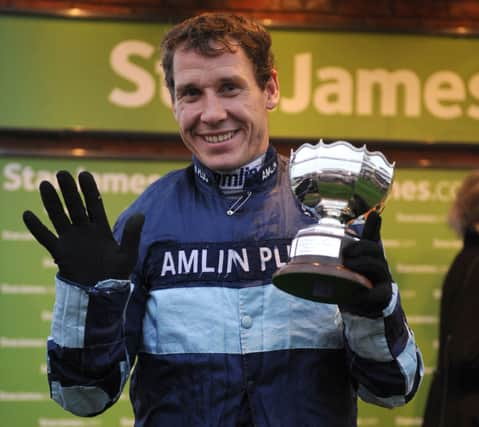 Jockey Richard Johnson celebrates a victory at Cheltenham earlier this year.