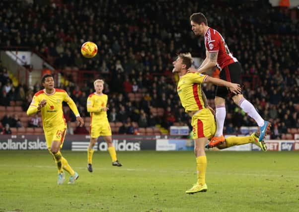 Blades' Paddy McCarthy goes close.