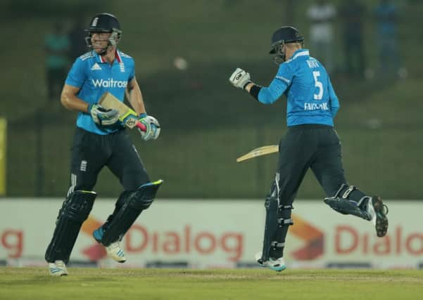 Yorkshires Joe Root, right, and Jos Buttler complete the run which confirmed Englands victory over Sri Lanka in Hambantota (Picture: Eranga Jayawardena/AP).