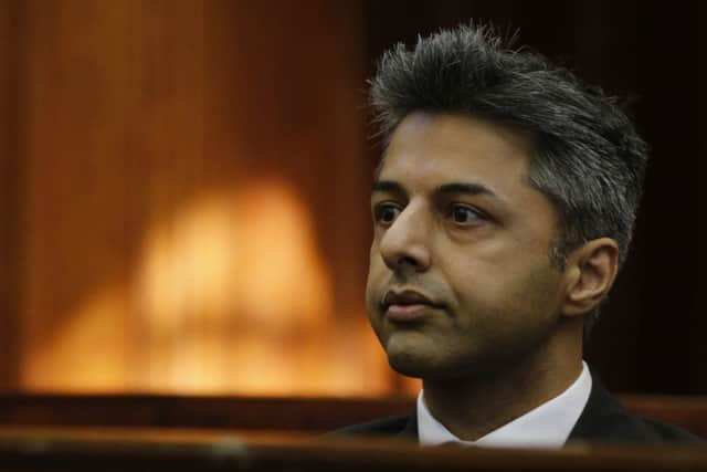 Ami Denborg, left,  and her brother Anish Hindocha, right, react after the court case that acquitted their sister's former husband Shrien Dwani from murdering her at the high court in Cape Town