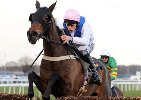 Night In Milan ridden by James Reveley jumps the last fence to win The William Hill Grimthorpe Chase Handicap Steeple Chase at Doncaster Racecourse