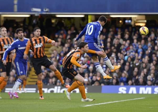 Chelsea's Eden Hazard (right) heads his sides first goal during the Barclays Premier League match at Stamford Bridge, London. PRESS ASSOCIATION Photo. Picture date: Saturday December 13, 2014. See PA story SOCCER Chelsea. Photo credit should read Andrew Matthews/PA Wire. Editorial use only. Maximum 45 images during a match. No video emulation or promotion as 'live'. No use in games, competitions, merchandise, betting or single club/player services. No use with unofficial audio, video, data, fixtures or club/league logos.