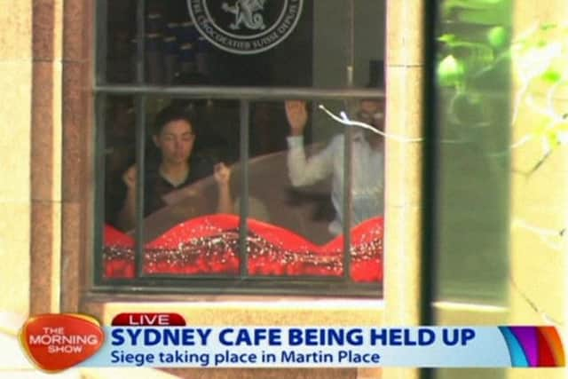 The scene at the cafe under siege at Martin Place in Sydney