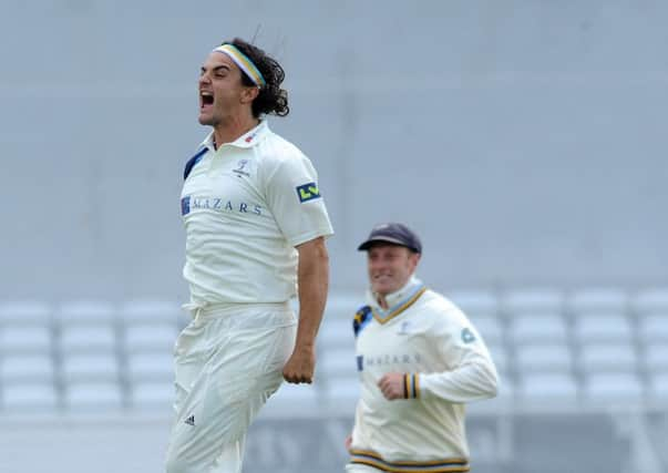 Yorkshire's 
Jack Brooks celebrates after bowling Varun Chopra