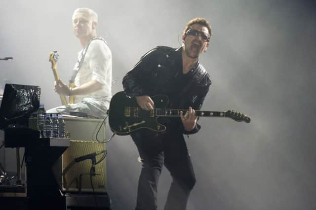 Bono, right, and Adam Clayton, from the rock group U2