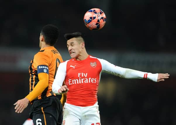 Hull Citys Curtis Davies gets the better of Arsenals Alexis Sanchez at Emirates Stadium, a rare moment of Tigers supremacy over the Chilean who was the FA Cup holders outstanding performer in their 2-0 victory (Picture: Daniel Hambury/PA Wire).