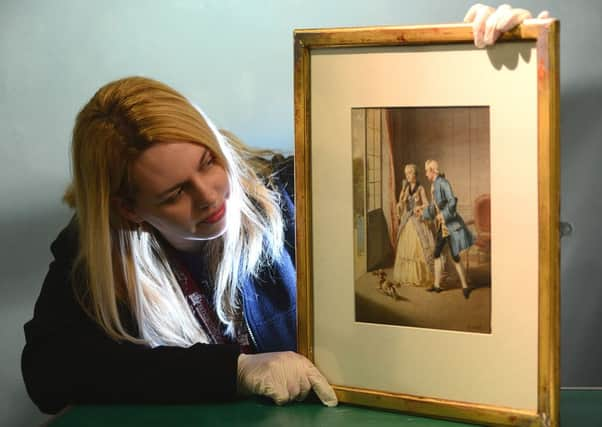 Tracey Hebron with Gustave David's 'Interior with Figures' at Barnsley's Cooper Gallery.