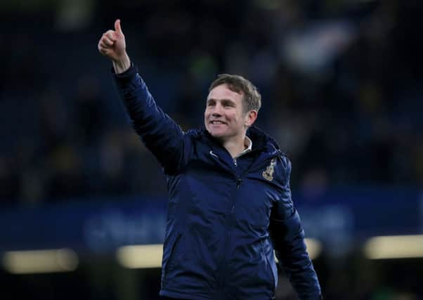 Bradford City manager Phil Parkinson celebrates at Stamford Bridge.