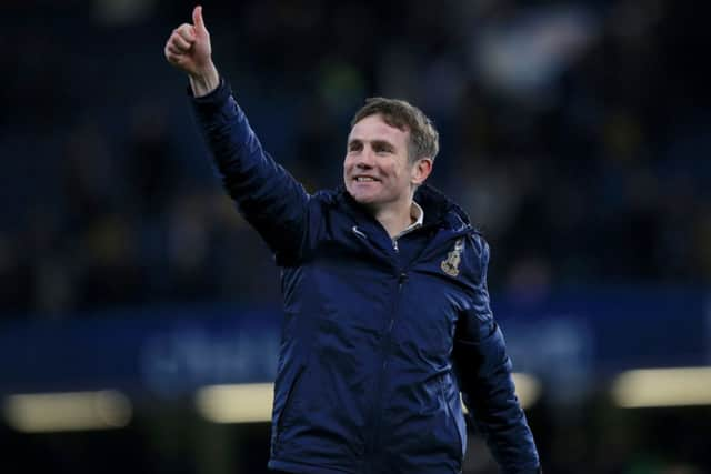 Bradford City manager Phil Parkinson celebrates at Stamford Bridge.