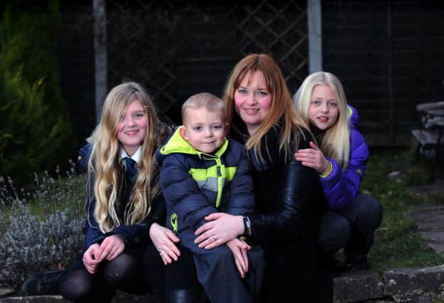 Oliver McDermott  pictured with mum Tracy and big sisters Evie and Ruby.