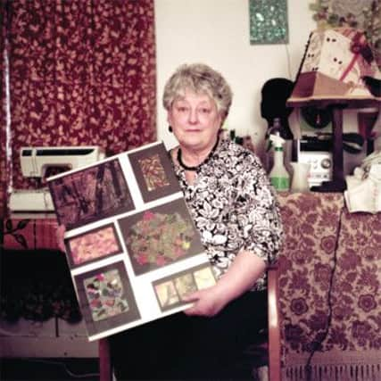 Helen with a collage made by her daughter, Catherine. Picture: Roshana Rubin Mayhew