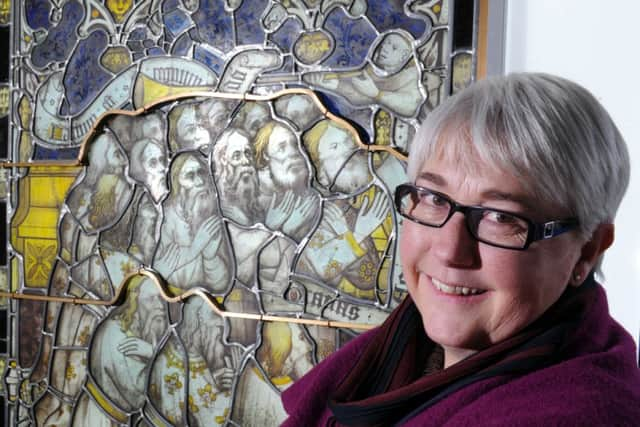 One of the newly restored stained glass panels entitled 'The Elders Worship God' which is on display to the public inside the Orb Gallery, York Minster.