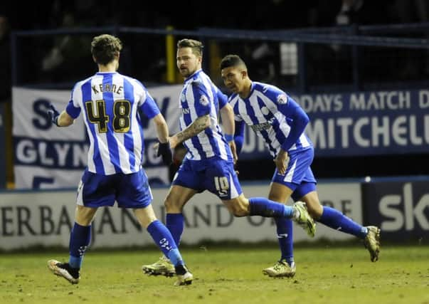 Chris Maguire, centre, is congratulated after scoring Sheffield Wednesdays goal. Sadly for the hosts, Blackburn Rovers were already two ahead (Picture: Steve Ellis).