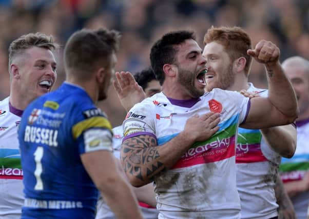 Hull Kingston Rovers' Kevin Larroyer celebrates his try against Warrington Wolves.