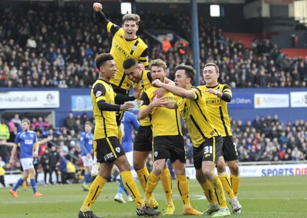 Lewin Nyatanga celebrates after scoring his second and Barnsley's third goal at Oldham.