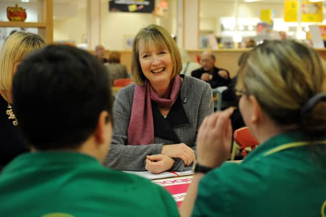 Harriet Harman in Rothwell, Leeds, chatting to staff on her Woman to Woman tour