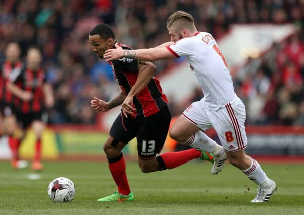 AFC Bournemouths Callum Wilson is challenged by Middlesbroughs Adam Clayton at Dean Court (Picture: PA).