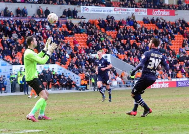 Leeds United substitute striker Mirco Antenucci lobs the ball over Blackpool goalkeeper Joe Lewis to make it 1-1 in Saturdays Championship encounter (Picture: Tony Johnson).