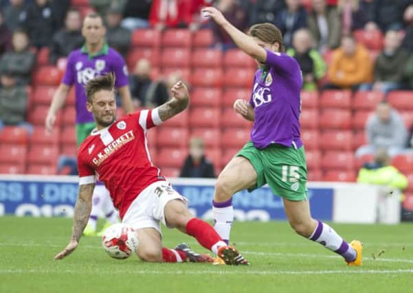 Barnsley's James Bailey in action against Bristol City's Luke Freeman when the two side met earlier in the season.