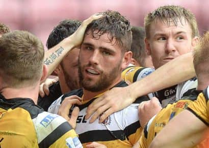 Castleford Tigers Lee Jewitt celebrates his Challenge Cup try against Wigan last June (Picture: Martin Rickett/PA).