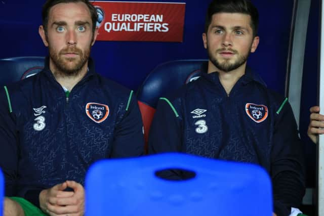 Republic of Ireland's Richard Keogh with Shane Long