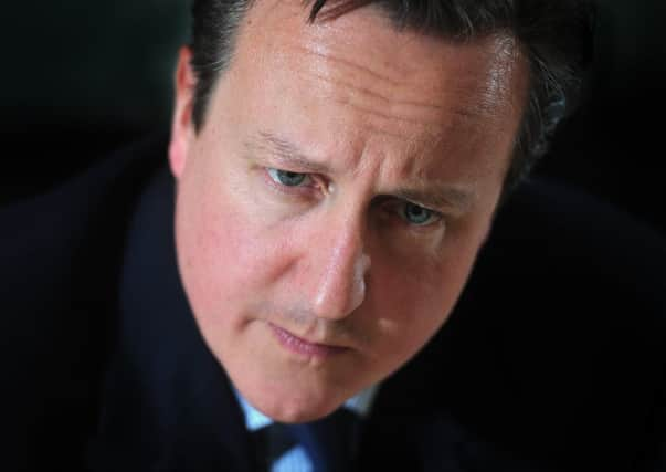 16 April 2015 .......       David Cameron on the election trail during a visit to the Yorkshire Post offices in Leeds. TJ100799a Picture Tony Johnson