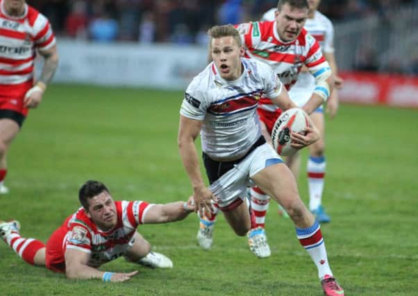 Wakefield's Jacob Miller on the attack.