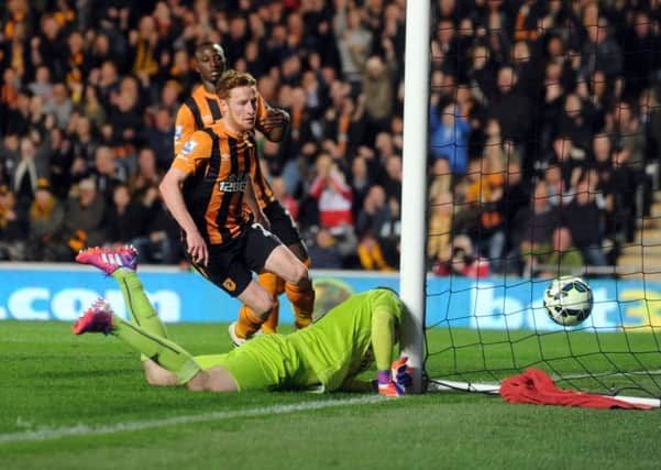 Stephen Quinn strikes as Hull win the second half against Arsenal (Picture: Simon Hulme).