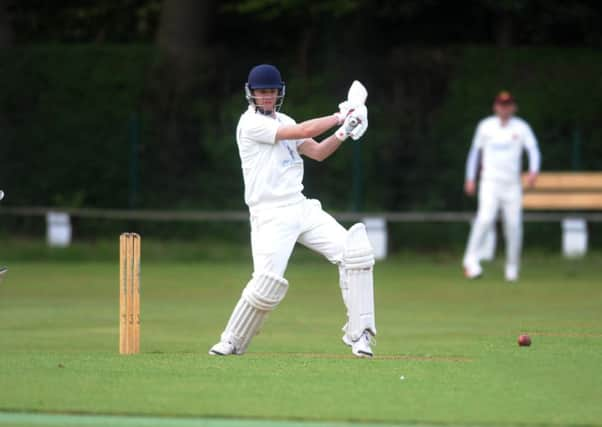 North Leeds's Andrew Carson hits through the covera against Bilton in their Aire-Wharfe encounter. Picture: Steve Riding.