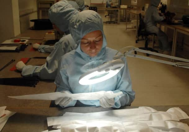 Work being carried out in the sterile room at Surgical Innovations Picture by Gerard Binks.